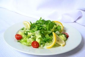 plate of fresh salad with lemon