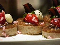 cakes with strawberries on a plate