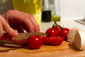 mozzarella and tomatoes on a wooden board