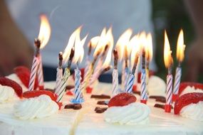 candles on strawberry cake