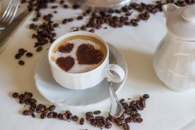 Cup of coffee with hearts on foam