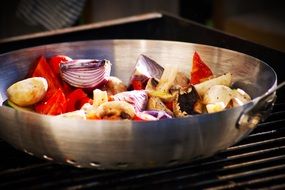 vegetables are cooked in a pan