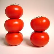 stacked red tomatoes