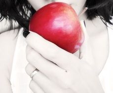 girl eating red apple