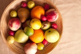 pear, lemon, apple, radish in basket for fruits