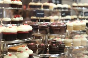 delicious chocolate cakes on plates in cafe