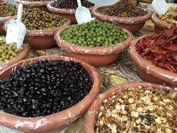 a variety of olives at the local farmers market in Italy