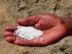 white salt in hand close-up