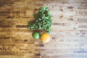 lemon, lime and mint on table