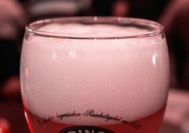 beer froth in a glass tumbler