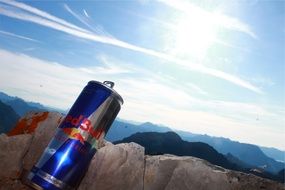 energy drink in the sunlight among the mountains