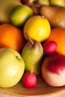 pear, lemon, apple, radish in basket