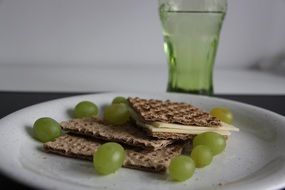 Grapes,crispbread with the grapes and drink