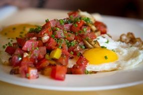 fried eggs with tomatoes