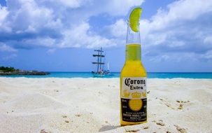 bottle of cold beer on the beach