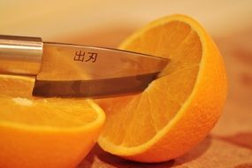 orange with knife