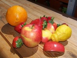 Sweet and ripe fruits on a wooden table