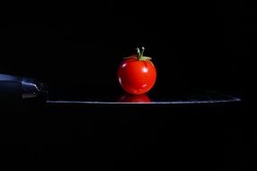 tomato on a sharp knife