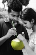 couple drink coconut