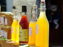 juices in bottles and honey in jars