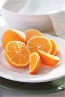 sliced oranges on a white plate