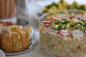 easter salad with eggs in glass bowl on table