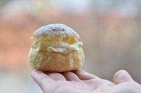 dessert with cream on her hand