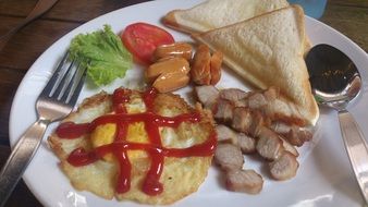 homemade breakfast with baked egg and meat