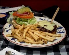 cheeseburger, french fries and pickled vegetables