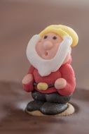 cake decoration of dwarf sugar figure