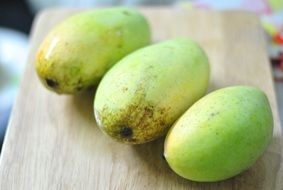 three mangoes on the table
