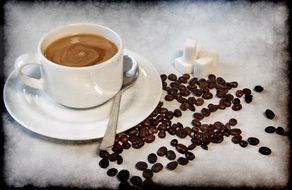 cup of aromatic freshly brewed coffee and beans