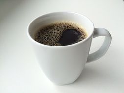 white cup with coffee