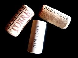 wine corks on a black background