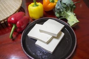 sliced tofu on a dark plate