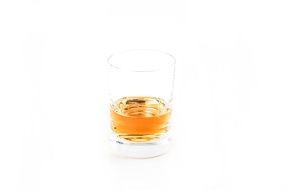 glass of whiskey on a white background