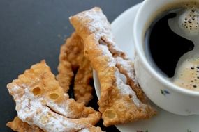 delicious sweet cookies with coffee close