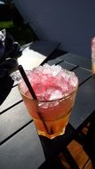 smoothy with ice in glass on table