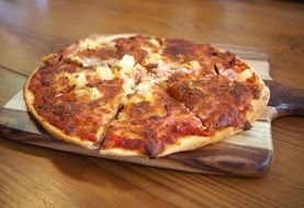 italian pizza on wooden board