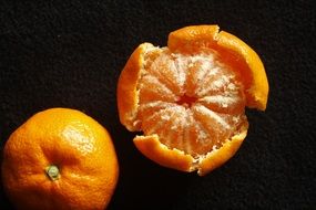 tangerines on a black background
