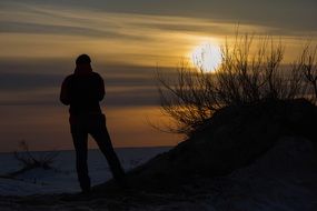 silhouette of a man against the backdrop of a beautiful sunset