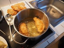 empanadas in the oil pot