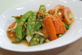 steamed vegetables on a white plate