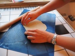 woman cooking dough for dumplings