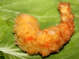 fried prawn on green leaf lettuce