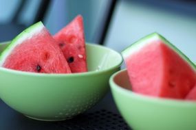 slices sweet watermelon in bowls