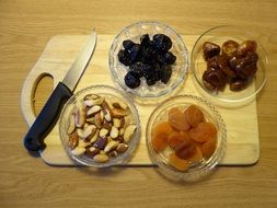 dried fruits with nuts on a cutting board