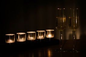 glasses of champagne near the candles