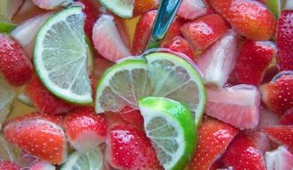 sliced strawberries with lime