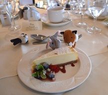 cheesecake and toys on banquet table